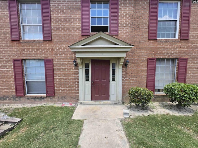 3630 Ranch Rd Unit 11-8, Columbia, SC 29260 - doorway to property featuring brick siding and a lawn