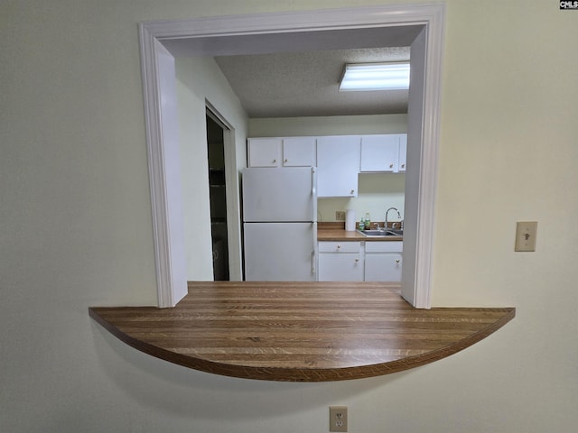 3630 Ranch Rd Unit 11-8, Columbia, SC 29260 - kitchen with freestanding refrigerator and white cabinetry