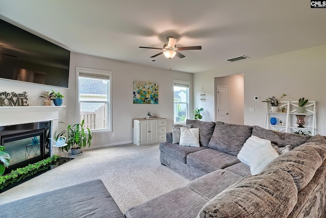 142 Summer Orchard Dr, Lexington, SC 29072 - living room featuring carpet, ceiling fan, plenty of natural light, and a fireplace with flush hearth