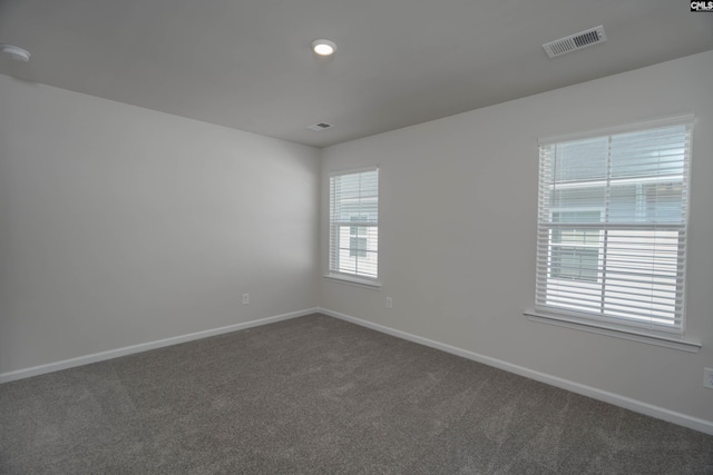 739 Wild Duck Ln, Columbia, SC 29203 - empty room featuring dark colored carpet and a smoke detector