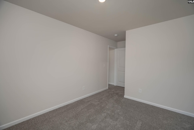 739 Wild Duck Ln, Columbia, SC 29203 - empty room with dark colored carpet and baseboards
