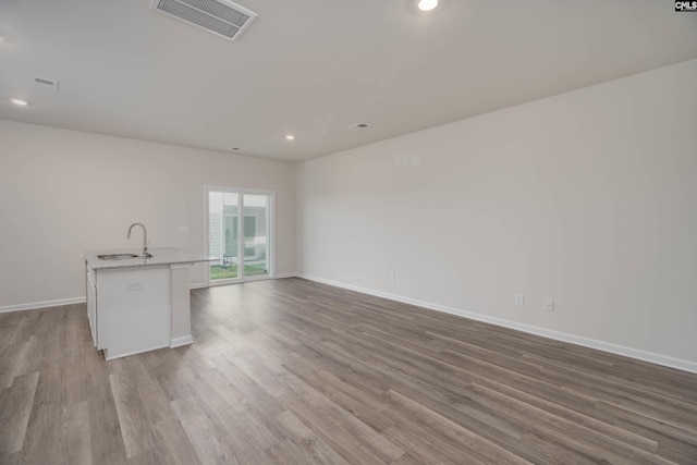 739 Wild Duck Ln, Columbia, SC 29203 - unfurnished living room featuring wood finished floors and recessed lighting