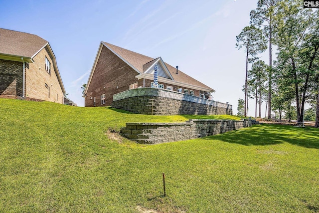 186 Backspin Dr, Elgin, SC 29045 - back of property with a yard and brick siding