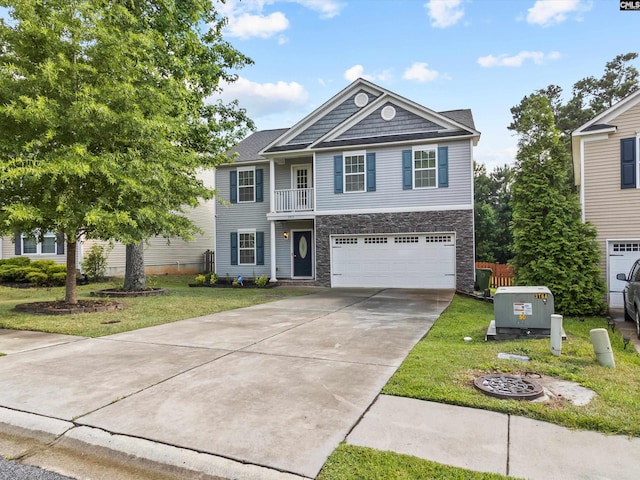 393 Denman Loop, Columbia, SC 29229 - view of front of property with stone siding, a garage, concrete driveway, a front yard, and a balcony
