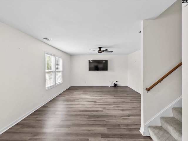 393 Denman Loop, Columbia, SC 29229 - unfurnished living room with ceiling fan, wood finished floors, and stairs