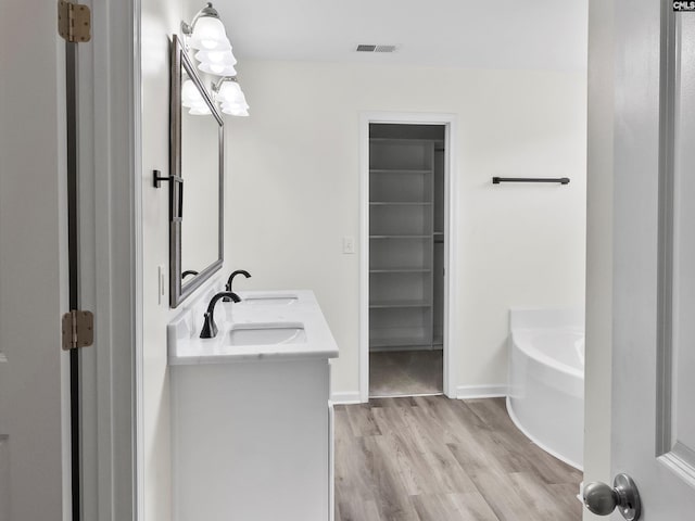 393 Denman Loop, Columbia, SC 29229 - bathroom with a bath, double vanity, and wood finished floors