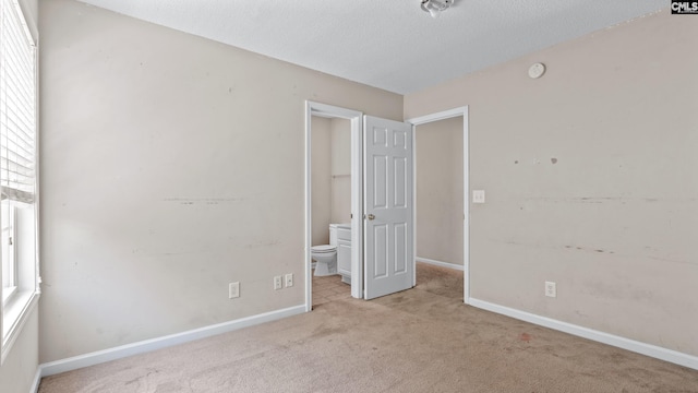 339 Cornflower Dr, Columbia, SC 29229 - unfurnished bedroom featuring carpet floors, a textured ceiling, and ensuite bathroom