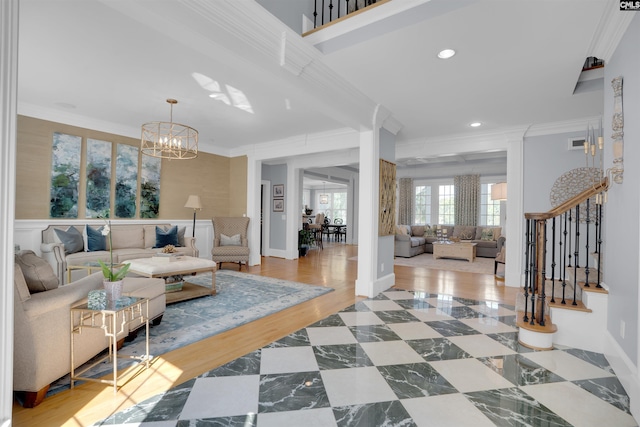 226 Forty Love Pt, Chapin, SC 29036 - living area with crown molding, a chandelier, stairs, and recessed lighting