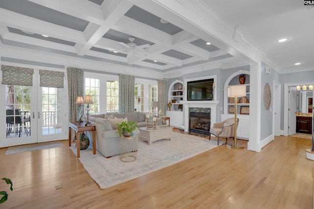 226 Forty Love Pt, Chapin, SC 29036 - living room with ceiling fan, light wood finished floors, a fireplace, french doors, and crown molding