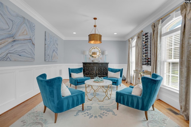 226 Forty Love Pt, Chapin, SC 29036 - living area featuring plenty of natural light, light wood-style flooring, ornamental molding, wainscoting, and recessed lighting