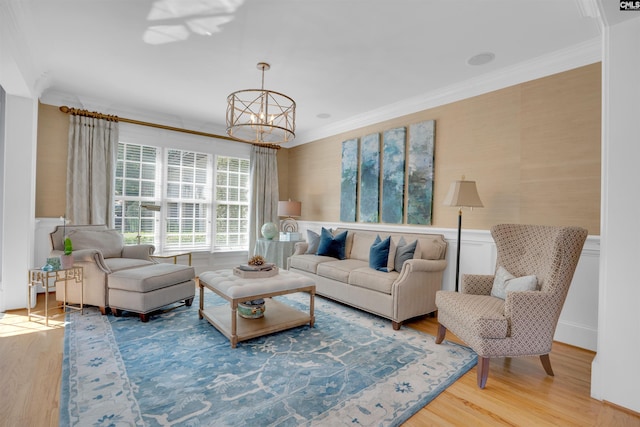 226 Forty Love Pt, Chapin, SC 29036 - living room with a chandelier, wood finished floors, ornamental molding, and wainscoting