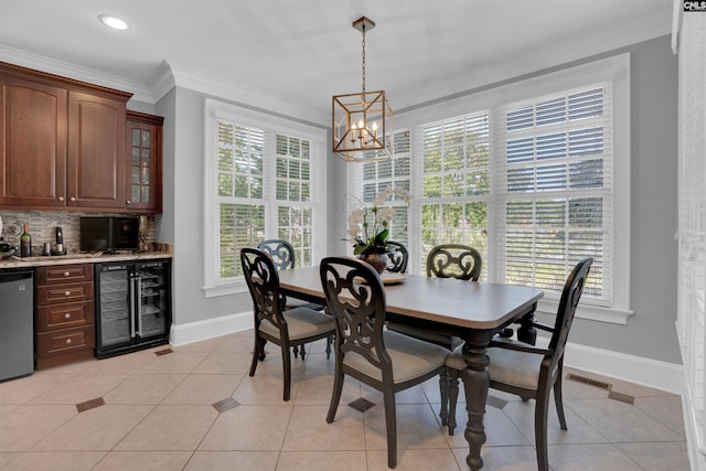 226 Forty Love Pt, Chapin, SC 29036 - dining space with wine cooler, ornamental molding, a chandelier, bar with sink, and light tile patterned floors