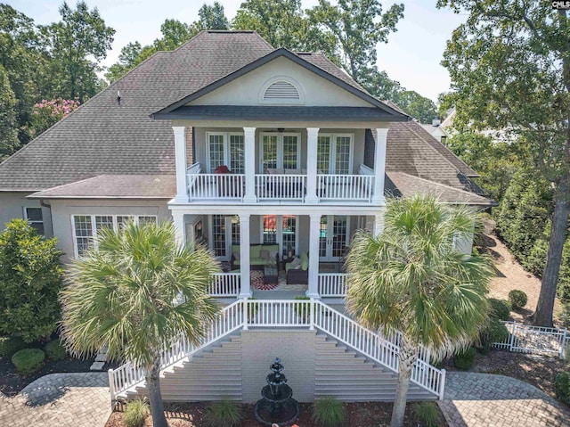 226 Forty Love Pt, Chapin, SC 29036 - view of front of home featuring covered porch, french doors, roof with shingles, and a balcony
