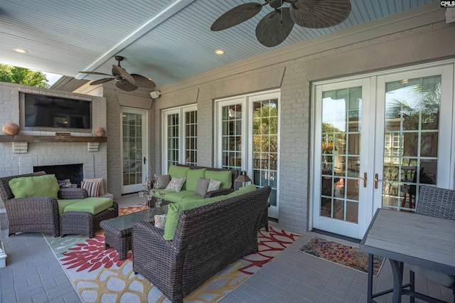 226 Forty Love Pt, Chapin, SC 29036 - view of patio with a ceiling fan, french doors, and an outdoor living space with a fireplace