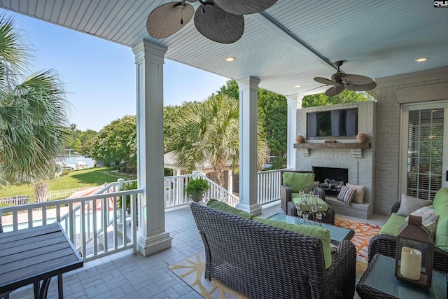 226 Forty Love Pt, Chapin, SC 29036 - view of patio / terrace featuring a ceiling fan and an outdoor living space with a fireplace