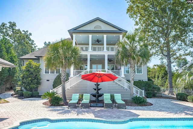 226 Forty Love Pt, Chapin, SC 29036 - back of house with stairs, a ceiling fan, and an outdoor pool