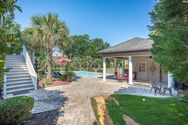226 Forty Love Pt, Chapin, SC 29036 - view of yard featuring stairway, a patio, and a ceiling fan