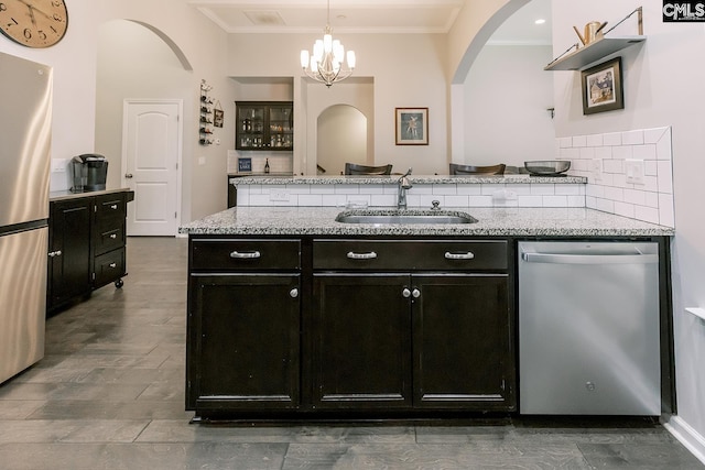 122 Azur Ave, Chapin, SC 29036 - kitchen featuring stainless steel appliances, arched walkways, ornamental molding, decorative light fixtures, and a chandelier
