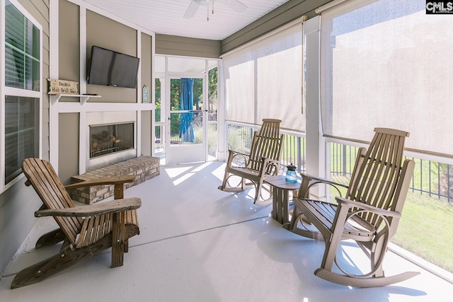 122 Azur Ave, Chapin, SC 29036 - sunroom / solarium with a ceiling fan, plenty of natural light, and a fireplace with raised hearth