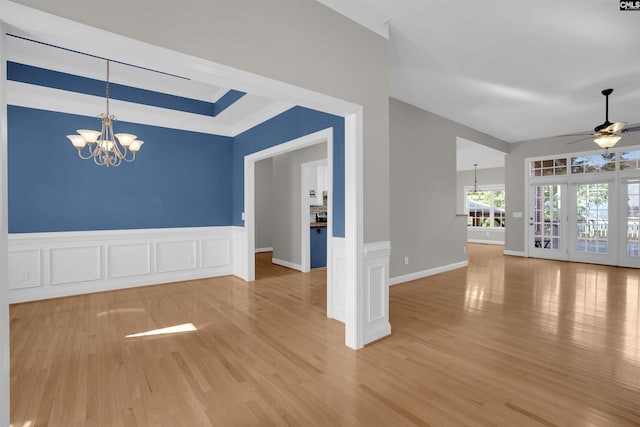 100 Ridge Top Rd, Lexington, SC 29072 - unfurnished dining area with a chandelier, wood finished floors, ceiling fan, wainscoting, and a decorative wall