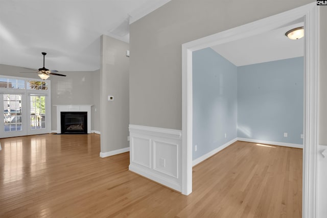 100 Ridge Top Rd, Lexington, SC 29072 - unfurnished living room with light wood-type flooring, a ceiling fan, and a fireplace with flush hearth