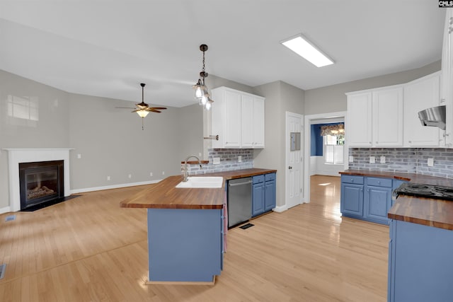 100 Ridge Top Rd, Lexington, SC 29072 - kitchen featuring wooden counters, blue cabinets, and stainless steel dishwasher