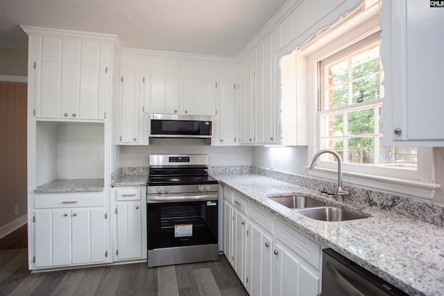 320 Perkins Ln, Camden, SC 29020 - kitchen with stainless steel appliances, dark wood-type flooring, and white cabinets