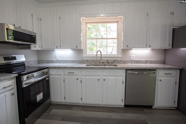 320 Perkins Ln, Camden, SC 29020 - kitchen featuring appliances with stainless steel finishes, white cabinetry, and dark wood finished floors