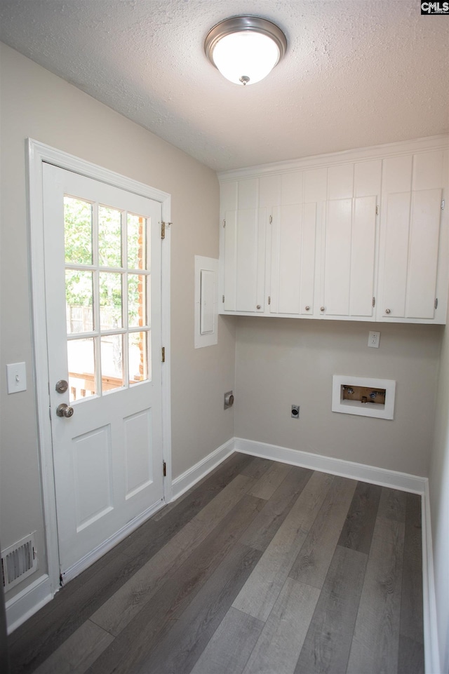 320 Perkins Ln, Camden, SC 29020 - washroom featuring cabinet space, hookup for an electric dryer, dark wood-style flooring, hookup for a washing machine, and a textured ceiling