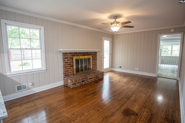 320 Perkins Ln, Camden, SC 29020 - unfurnished living room with crown molding, healthy amount of natural light, wood finished floors, and ceiling fan