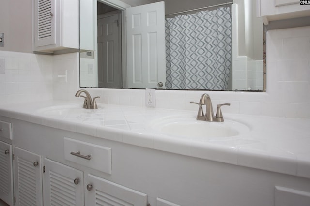 320 Perkins Ln, Camden, SC 29020 - bathroom with double vanity and decorative backsplash