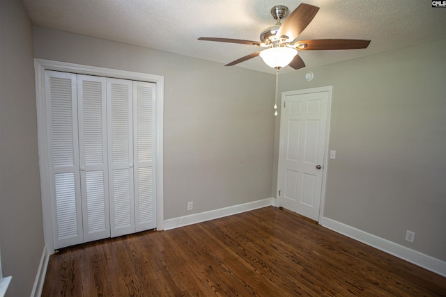 320 Perkins Ln, Camden, SC 29020 - unfurnished bedroom with dark wood-type flooring, a closet, ceiling fan, and a textured ceiling