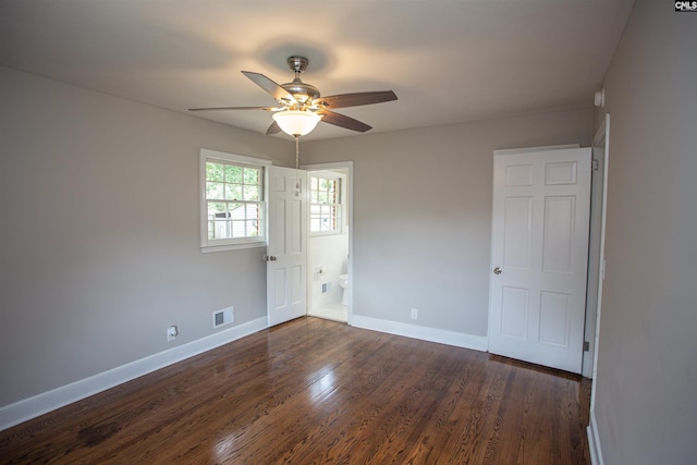 320 Perkins Ln, Camden, SC 29020 - spare room with a ceiling fan and dark wood-type flooring