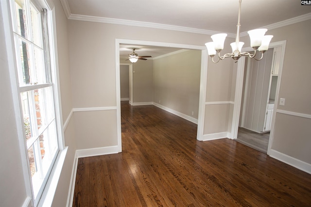 320 Perkins Ln, Camden, SC 29020 - unfurnished dining area featuring healthy amount of natural light, crown molding, a chandelier, dark wood-type flooring, and ceiling fan