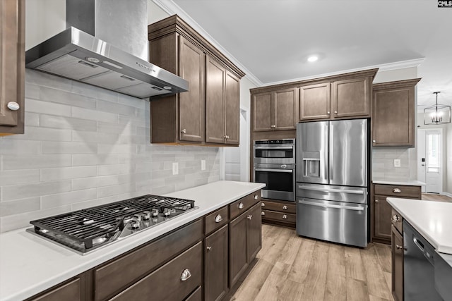 478 Harbour Pointe Dr, Columbia, SC 29229 - kitchen with stainless steel appliances, wall chimney exhaust hood, light countertops, decorative backsplash, and crown molding