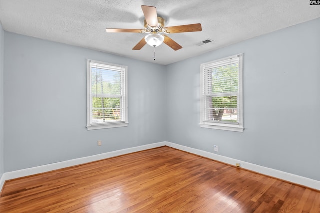 231 Horseshoe Cir, Columbia, SC 29223 - spare room with wood finished floors, a textured ceiling, and a ceiling fan