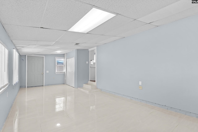 231 Horseshoe Cir, Columbia, SC 29223 - spare room with light tile patterned floors, a paneled ceiling, and healthy amount of natural light