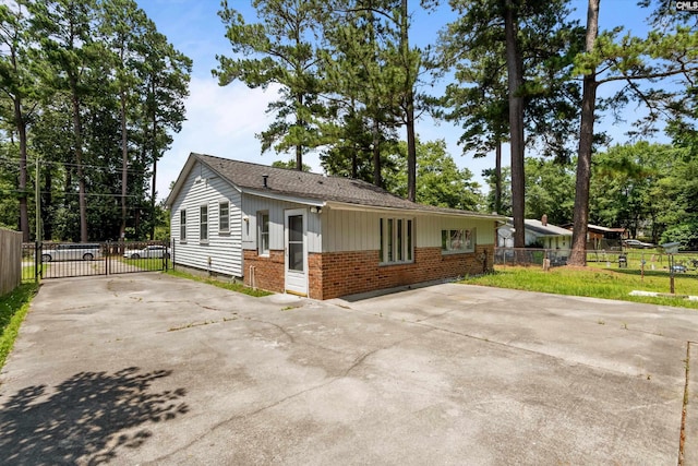 231 Horseshoe Cir, Columbia, SC 29223 - ranch-style house with brick siding, driveway, and a gate