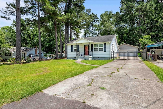 231 Horseshoe Cir, Columbia, SC 29223 - view of front of home featuring crawl space, a gate, a detached garage, and an outdoor structure