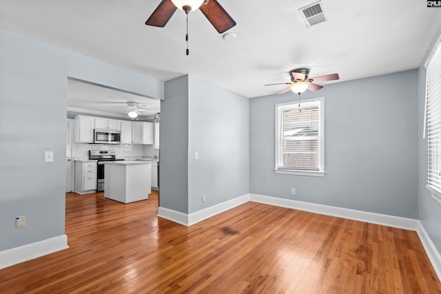 231 Horseshoe Cir, Columbia, SC 29223 - unfurnished living room featuring ceiling fan and light wood-style floors