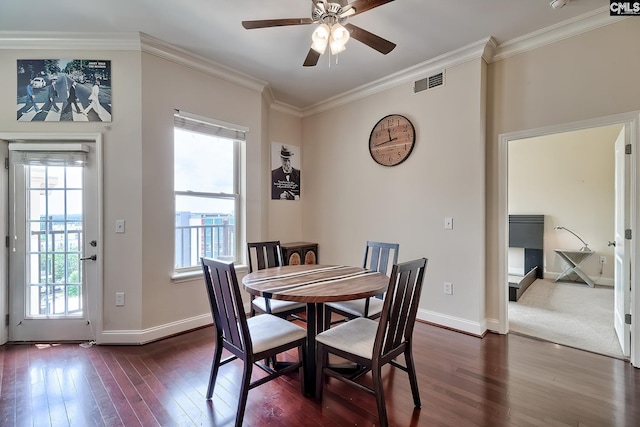 601 Main St Unit 518, Columbia, SC 29201 - dining room featuring ceiling fan, dark wood-style floors, healthy amount of natural light, and crown molding