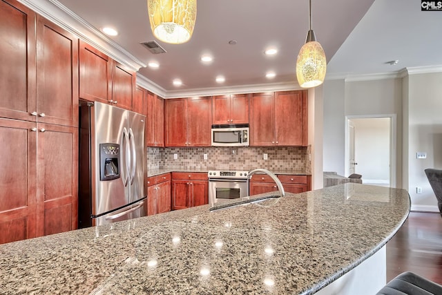 601 Main St Unit 518, Columbia, SC 29201 - kitchen featuring stainless steel appliances, ornamental molding, decorative backsplash, dark wood-style flooring, and dark stone countertops