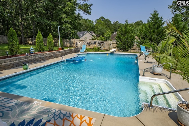 614 Beech Branch Dr, Irmo, SC 29063 - view of swimming pool with a patio area, a fenced backyard, and view of scattered trees