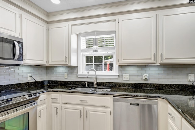 614 Beech Branch Dr, Irmo, SC 29063 - kitchen featuring stainless steel appliances, white cabinetry, backsplash, and ornamental molding
