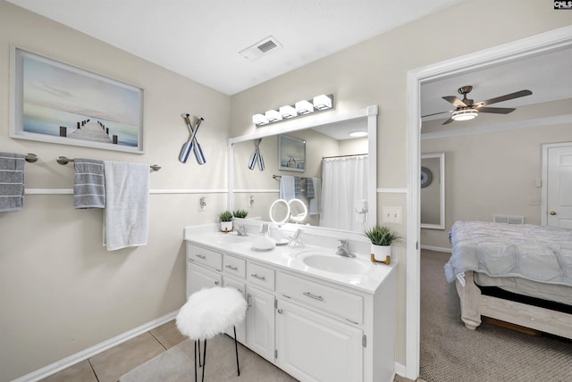 614 Beech Branch Dr, Irmo, SC 29063 - ensuite bathroom with double vanity, a ceiling fan, and tile patterned floors