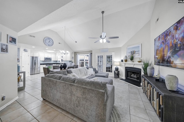 614 Beech Branch Dr, Irmo, SC 29063 - living area with ceiling fan, a chandelier, a fireplace, light tile patterned flooring, and high vaulted ceiling