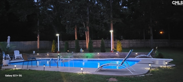 614 Beech Branch Dr, Irmo, SC 29063 - pool at night with a fenced backyard