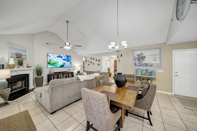 614 Beech Branch Dr, Irmo, SC 29063 - dining space featuring light tile patterned floors, a chandelier, high vaulted ceiling, a fireplace, and ceiling fan
