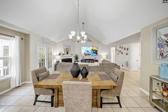 614 Beech Branch Dr, Irmo, SC 29063 - dining space with a chandelier, light tile patterned floors, lofted ceiling, and a fireplace