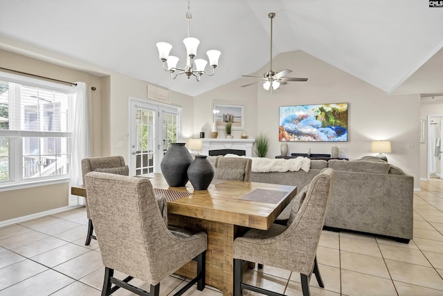 614 Beech Branch Dr, Irmo, SC 29063 - dining space featuring light tile patterned floors, lofted ceiling, a chandelier, a fireplace, and a ceiling fan